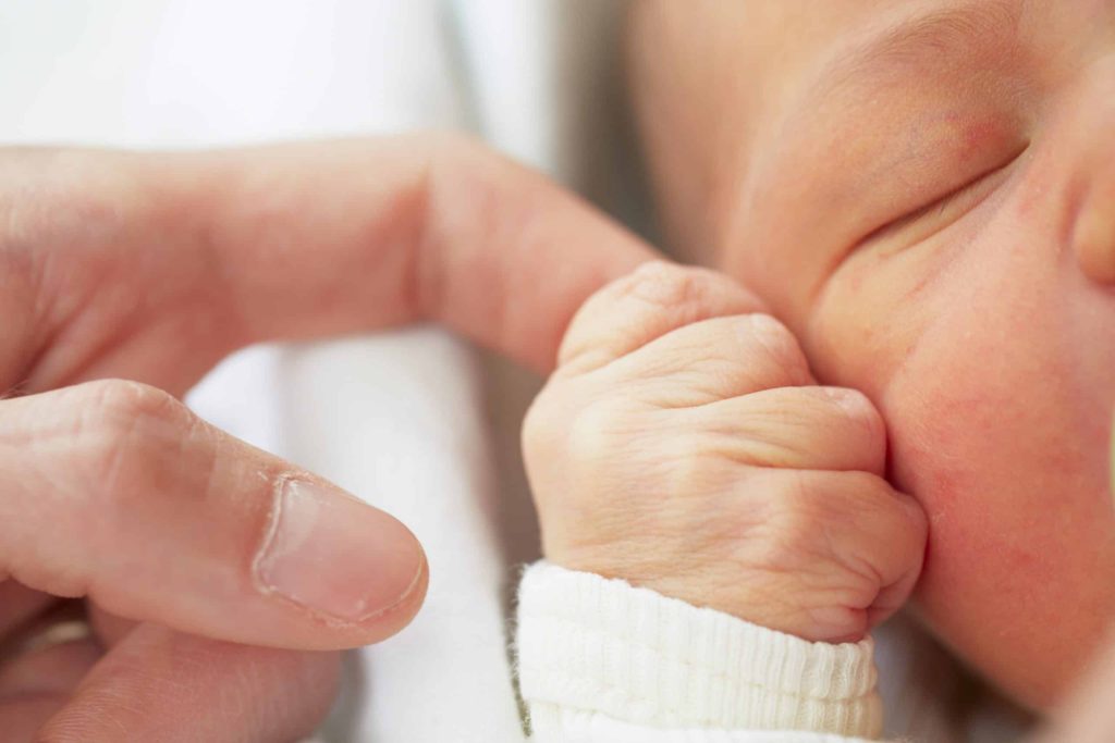 Baby holding mum hand finger, New Eve Centre